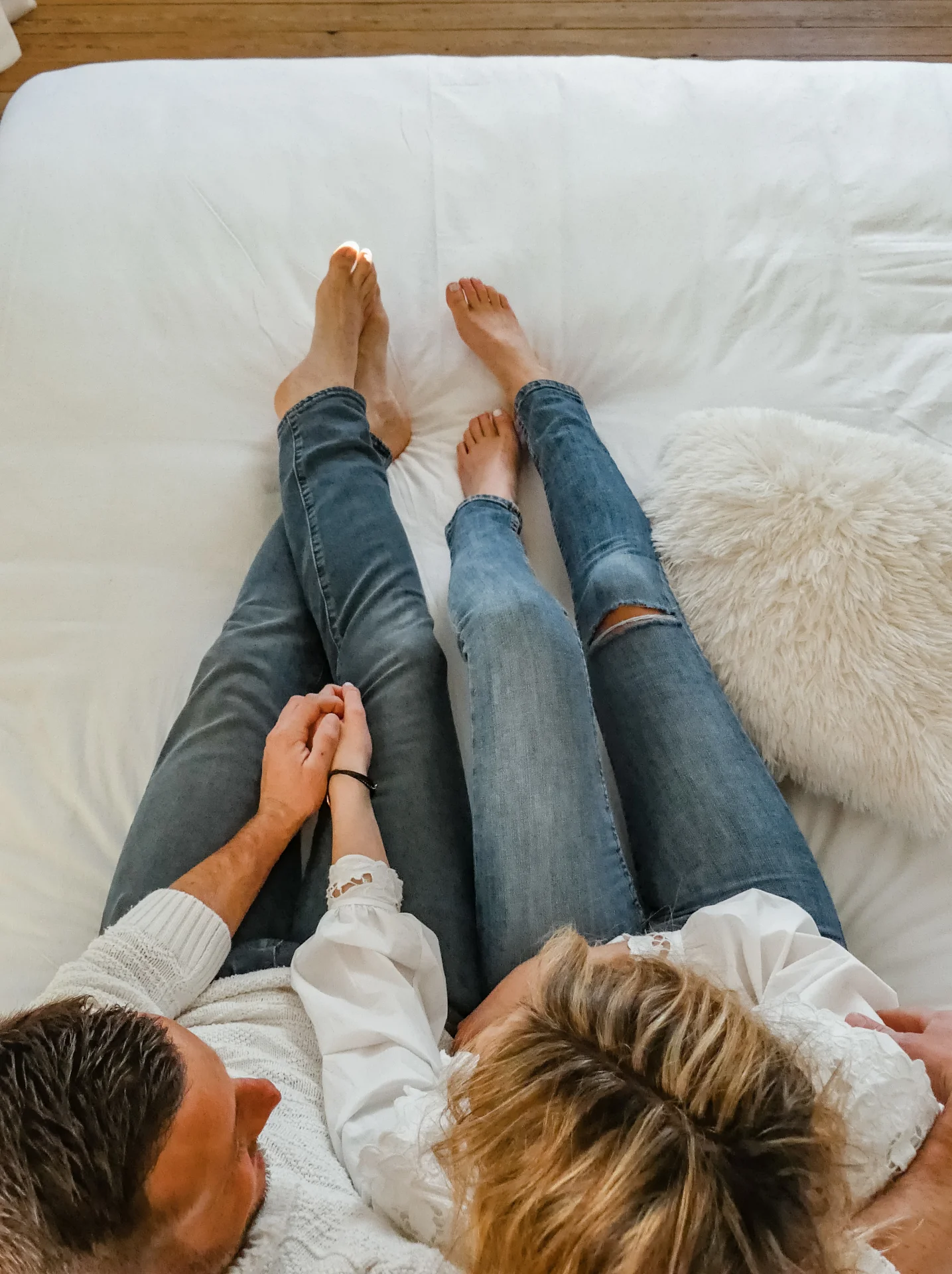 Couple relaxing in the Comfort Suite at Hotel Savel Ruoms for a romantic stay in Ardèche - Hotel suite in Ruoms